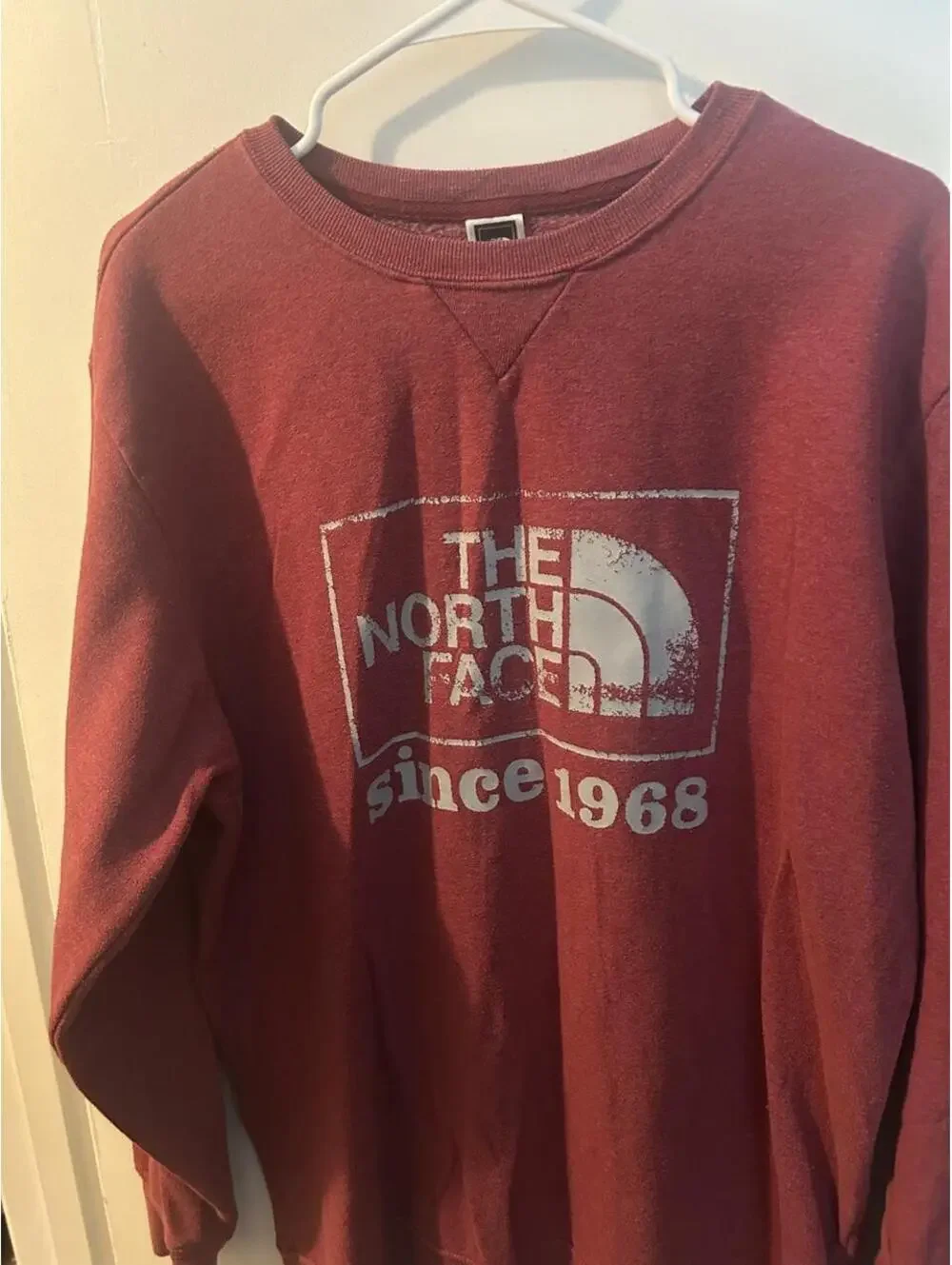 The North Face red sweatshirt with white logo and 'since 1968' text size L